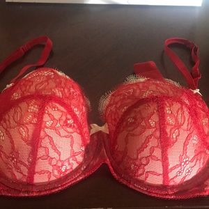 Sex red lace bra. Never worn. Cream background.